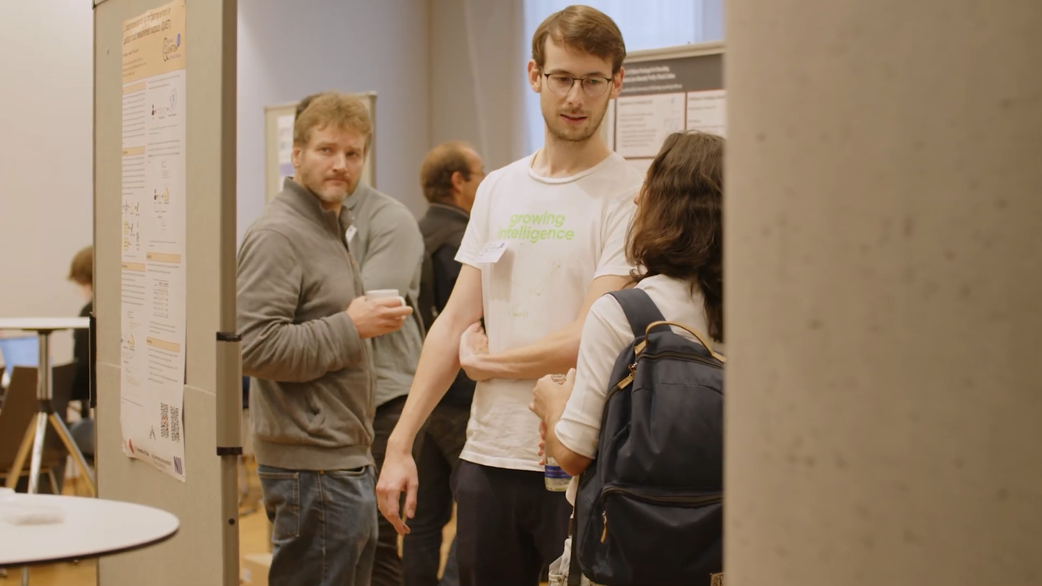 Participants discussing software at a poster session